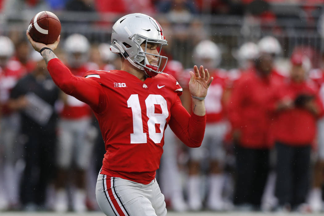 Ohio State quarterback Tate Martell plays against Rutgers during an NCAA college football ga ...