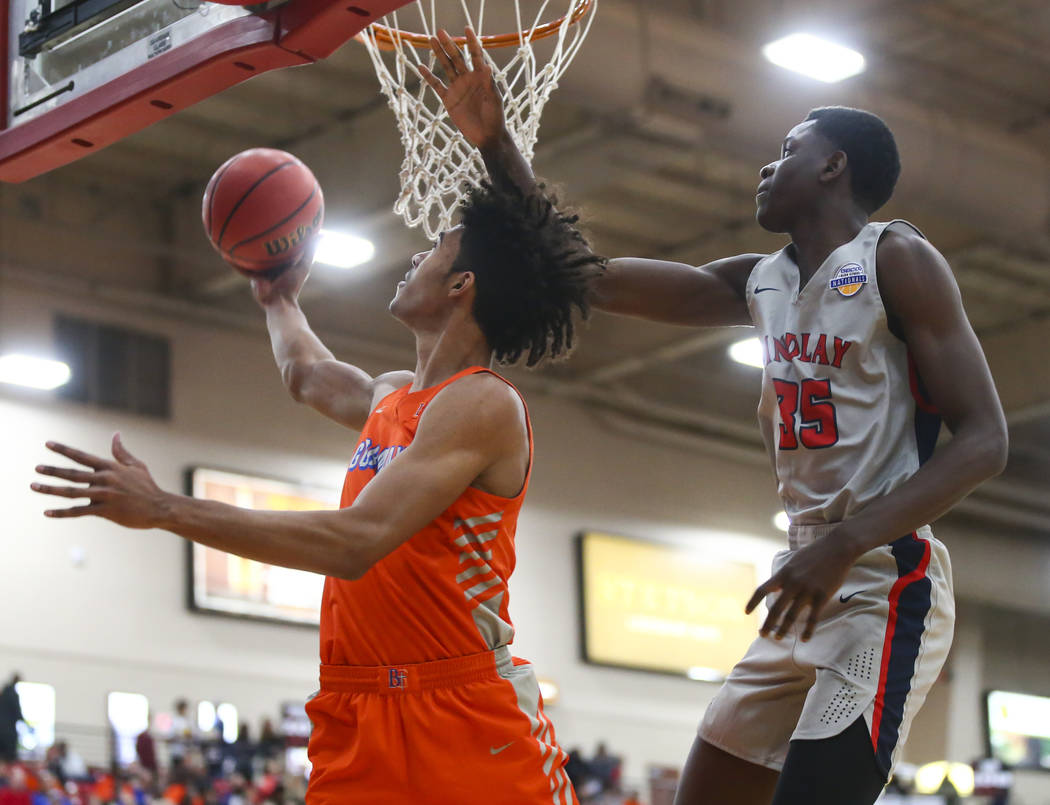 Bishop Gorman’s Isaiah Cottrell goes to the basket in front of Findlay Prep’s Al ...