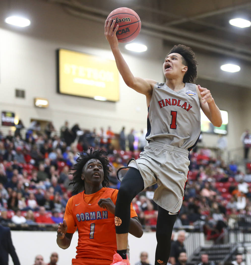 Findlay Prep’s Blaise Beauchamp (1) goes to the basket over Bishop Gorman’s Will ...