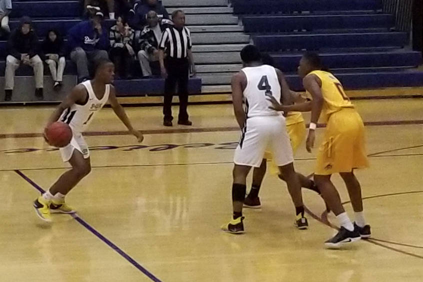 Democracy Prep’s Najeeb Muhammad, left, drives to the basket against Del Sol on Tuesda ...