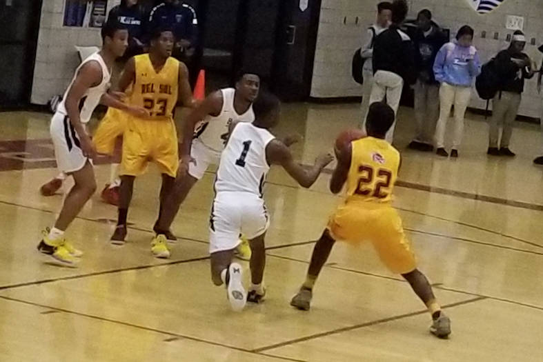 Democracy Prep’s Najeeb Muhammad, left, defends Del Sol’s LaVerk Hodges on Tuesd ...