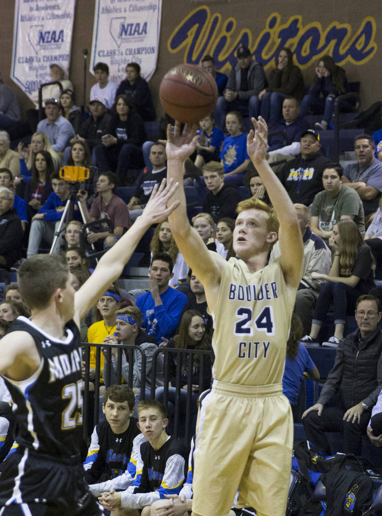 Boulder City sophomore guard Matt Morton (24) shoots a corner three over Moapa Valley sophom ...