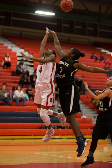 Liberty’s Starr Walker (4) goes up for a shot against Bonita Vista’s Keyanna McC ...