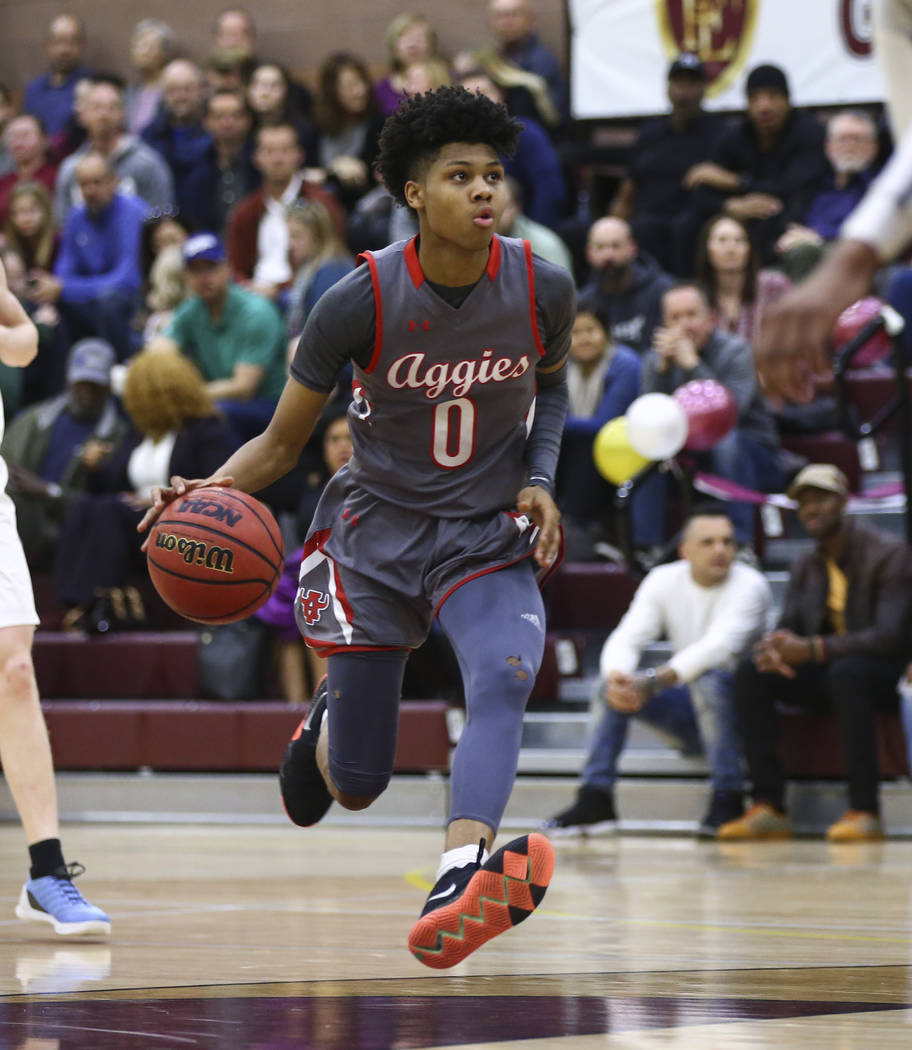 Arbor View’s Donovan Yap (0) drives the ball during the first half of a basketball gam ...