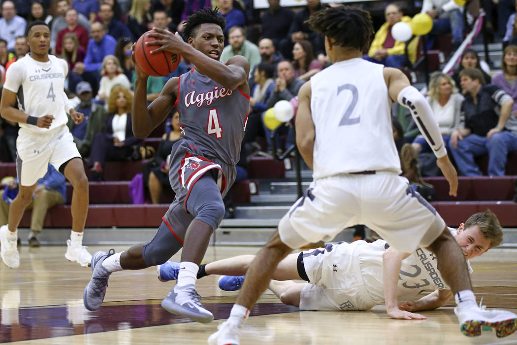 Arbor View’s Tyre Williams (4) drives the ball against Faith Lutheran’s Donavan ...