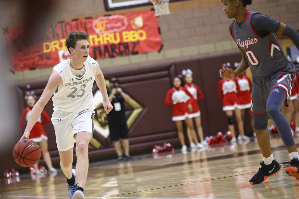 Faith Lutheran’s Brevin Walter (23) brings the ball up court against Arbor View’ ...