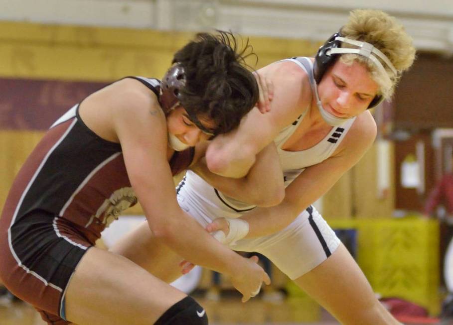 Daniel Rodriguez of Cimarron-Memorial High School, left, and Carson Cook from Faith Lutheran ...