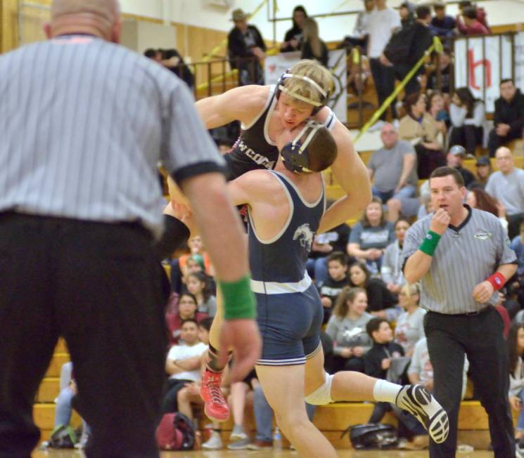 Caleb Roach of Cimarron-Memorial High School, top, and Kody Presser from Shadow Ridge High S ...