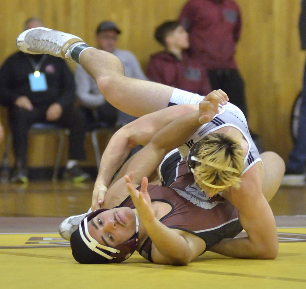 Kevin Love of Cimarron-Memorial High School, bottom, and Connor Bourne from Faith Lutheran H ...