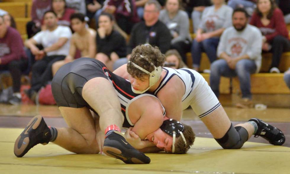 Noah Gallardo from Shadow Ridge High School, in white, and Johnny Broadhead of Las Vegas Hig ...