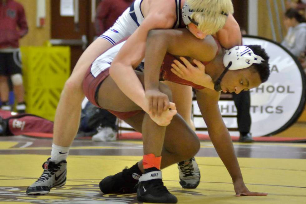 Matthew Rodgers of Cimarron-Memorial High School (in dark jersey) and Marc Williams from Sha ...