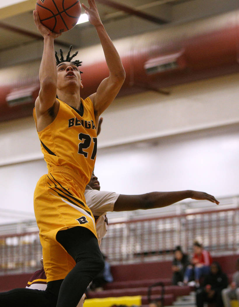 Bonanza’s Trent Savage (21) jumps up to take a shot during a game at Eldorado High Sch ...