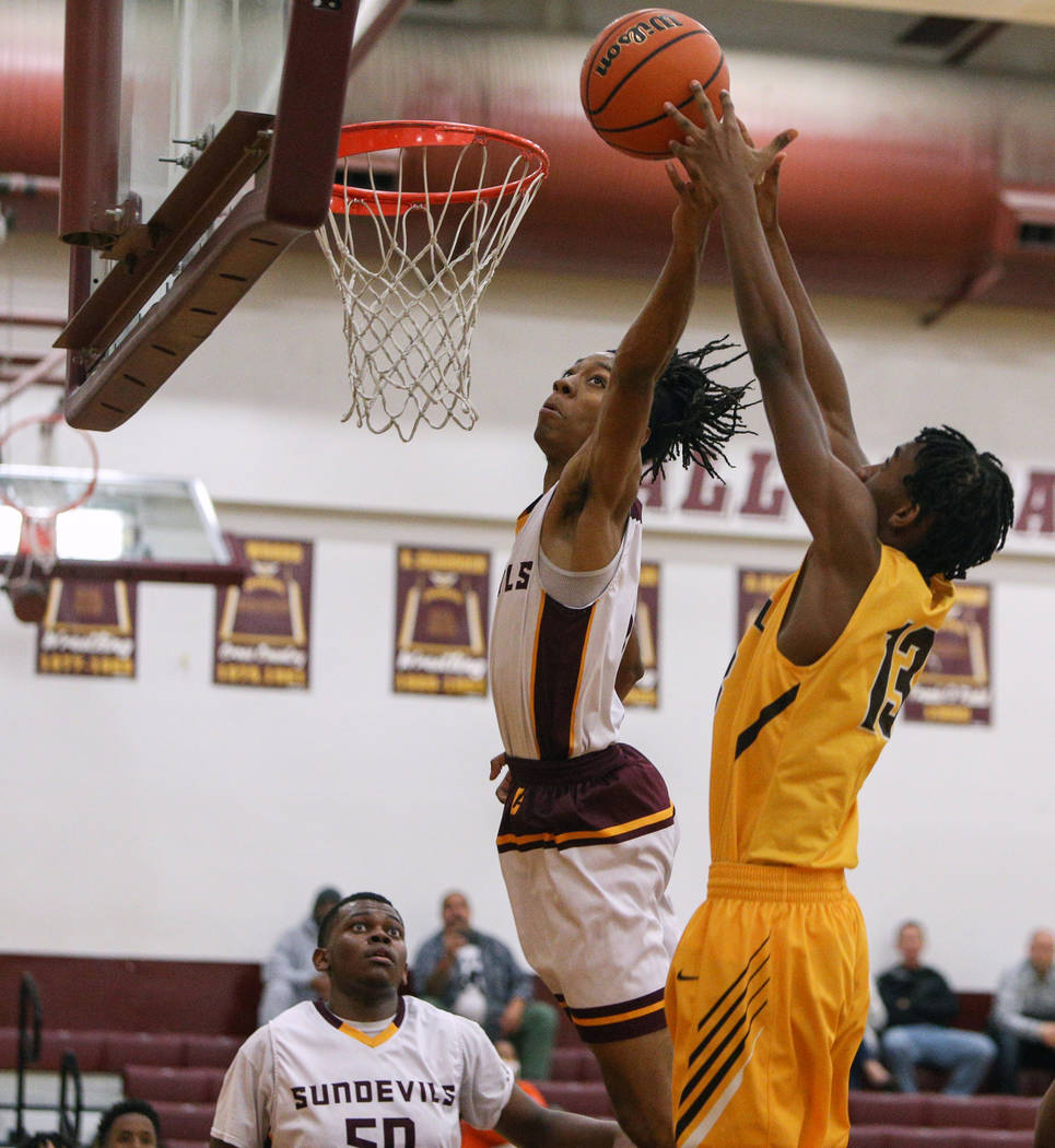 Eldorado’s Jonathan Thomas (3) blocks a shot by Bonanza’s Ricky Esdel (13) durin ...