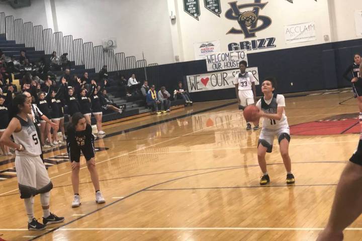 Spring Valley senior guard Rory Carter shoots a free throw in the fourth quarter of an 82-55 ...