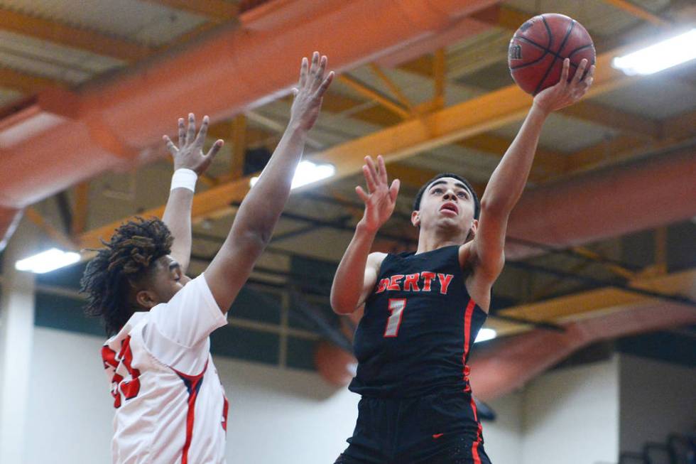 Liberty’s Kobe Stroughter (1) shoots a lay up over Coronado’s Jhaylon Martinez ( ...