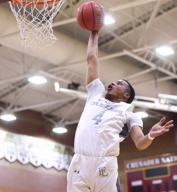 Faith Lutheran’s Sedrick Hammond (4) goes to the basket against Cheyenne during the fi ...