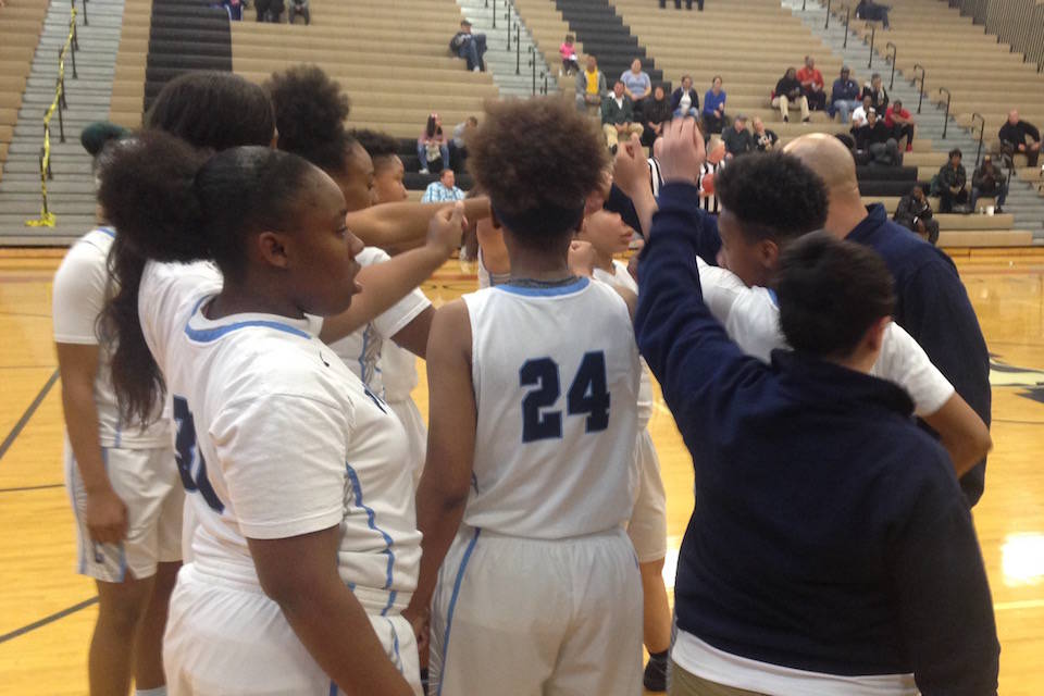 Canyon Springs players gather during a timeout in their 66-43 win over Faith Lutheran on Tue ...