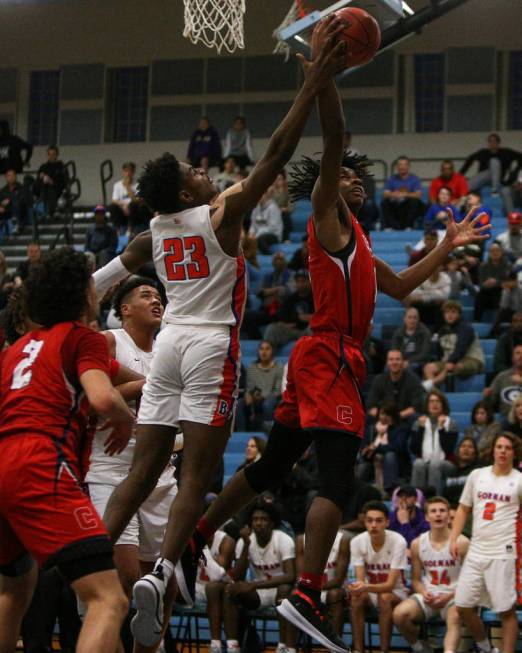 Coronado’s Jaden Hardy (1) jumps up to take a shot while being guarded by Bishop Gorma ...