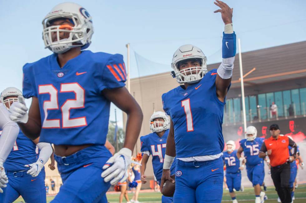 Bishop Gorman junior quarterback Micah Bowens (1) salutes the crowd as the Gaels take the fi ...