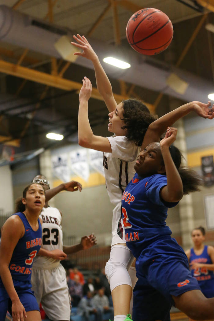 Bishop Gorman’s Aaliyah Bey (12) blocks a shot by Desert Oasis’ Eliyjah Pricebro ...