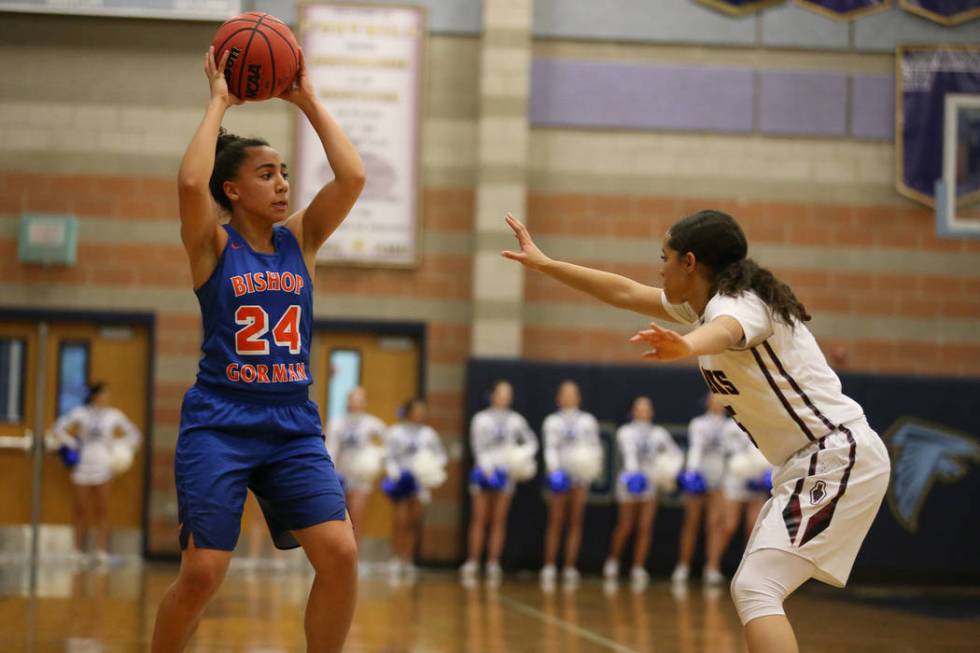 Bishop Gorman’s Bentleigh Hoskins (24) looks to make a play under pressure from Desert ...