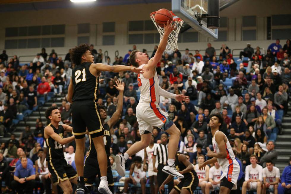 Bishop Gorman’s Chance Michels (25) goes up for a shot against Clark in the Desert Reg ...