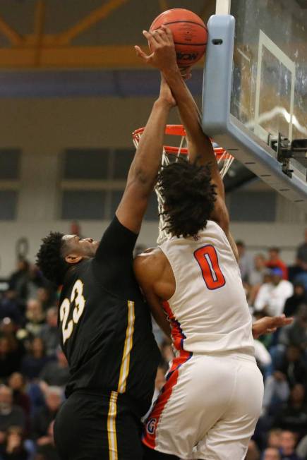 Clark’s Antwon Jackson (23) makes a block against Bishop Gorman’s Isaiah Cottrel ...