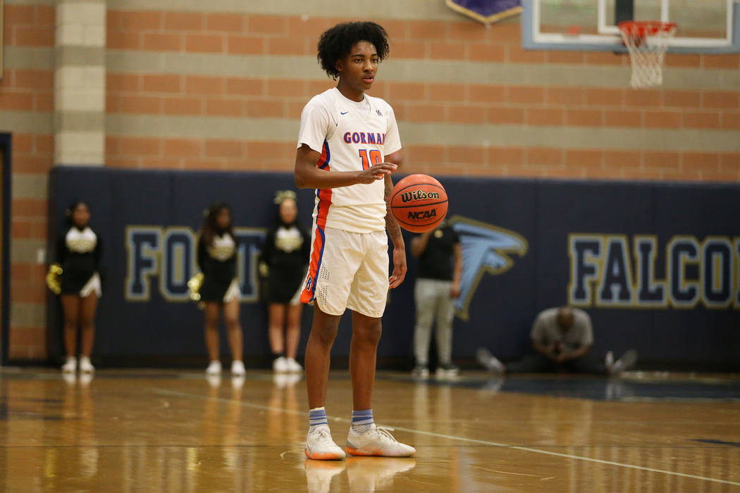 Bishop Gorman’s Zaon Collins (10) lets the clock run against Clark in the Desert Regio ...