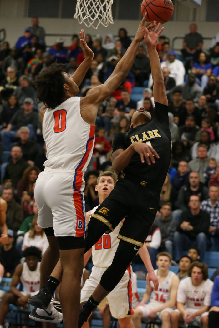 Clark’s Frankie Collins(1) gets his shot blocked by Bishop Gorman’s Isaiah Cottr ...