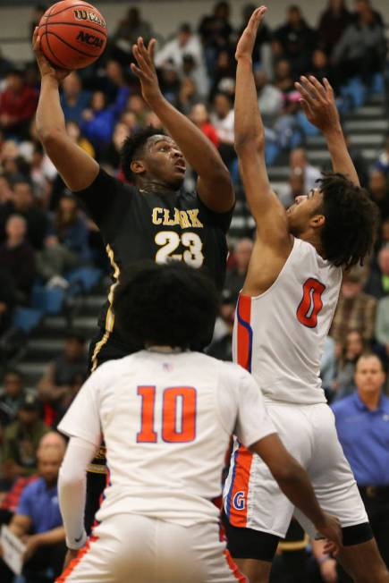 Clark’s Antwon Jackson (23) goes up for a shot against Bishop Gorman’s Isaiah Co ...