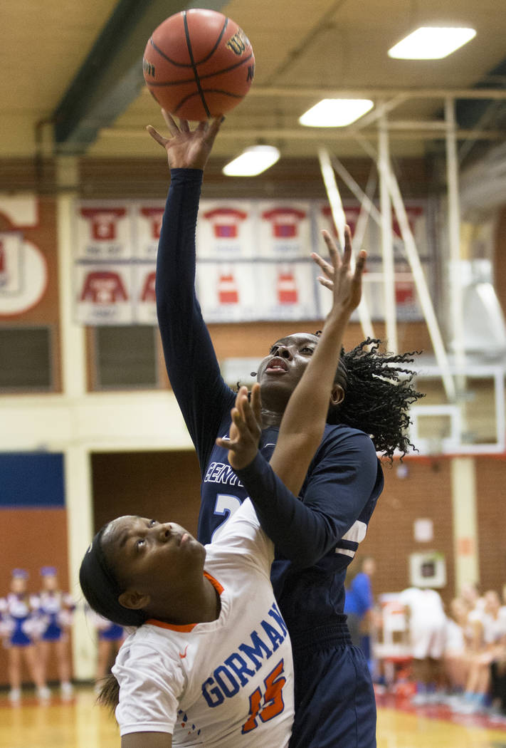 Centennial senior Eboni Walker (22) shoots a jump shot over Bishop Gorman freshman Asya Bey ...