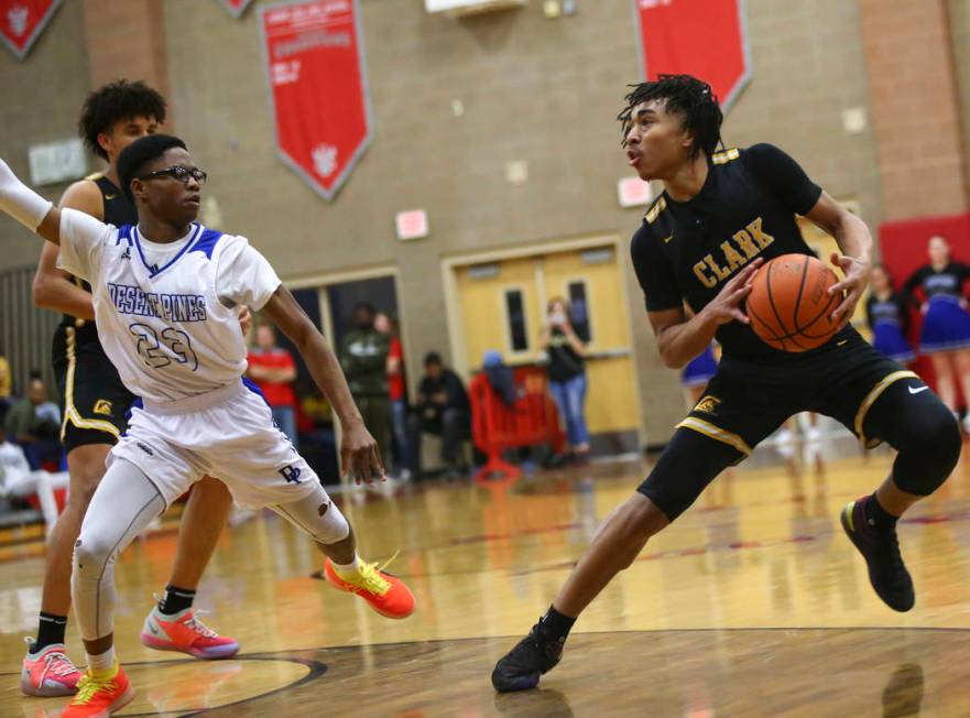 Clark’s Frankie Collins (1) moves the ball around Desert Pines’ LaRonte Dorsey ( ...