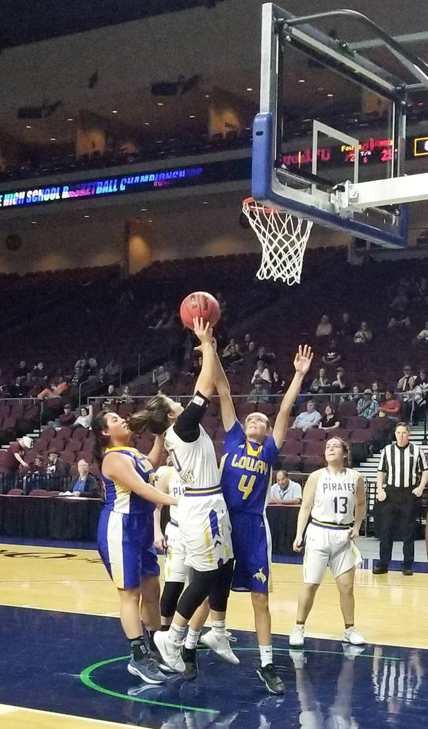 Moapa Valley’s Peyton Schraft shoots over Lowry’s Rebecca Kuskie in the Class 3A ...