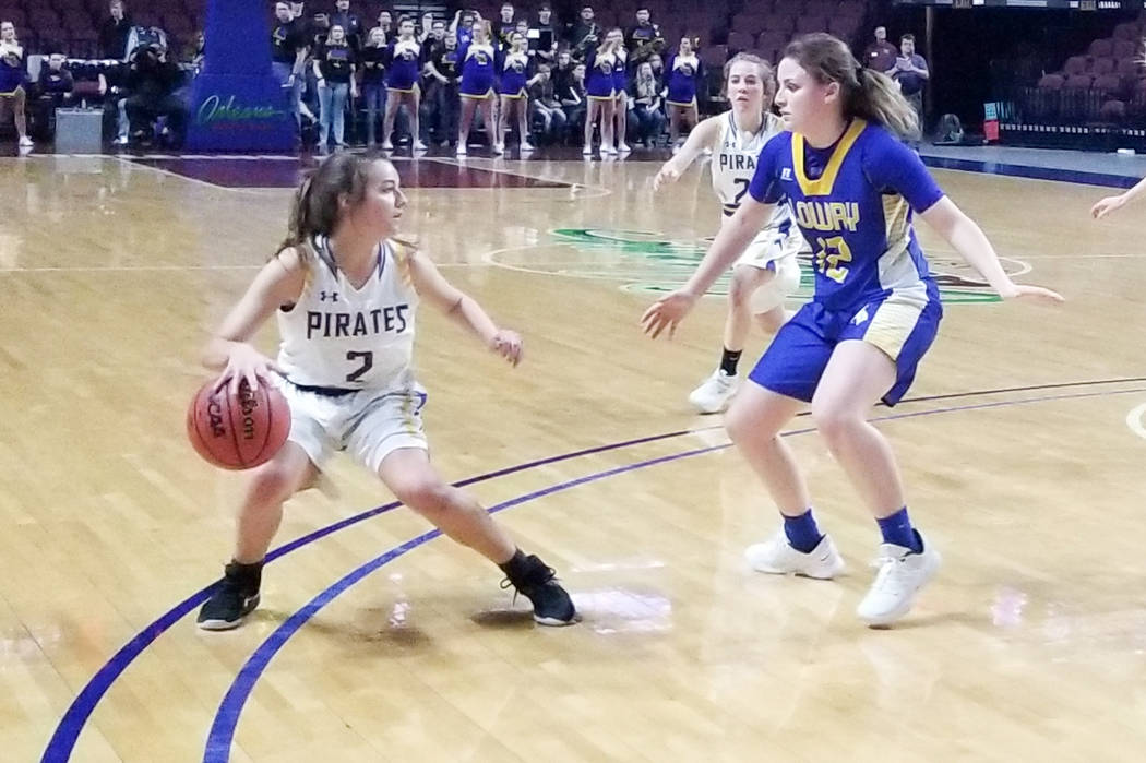 Moapa Valley’s Andalin Hillstead handles the ball as Lowry’s Sydney Connors defe ...