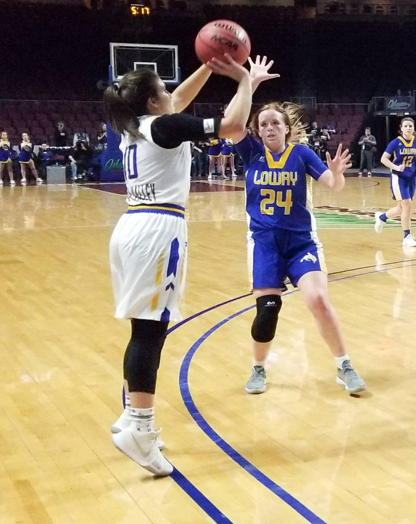 Moapa Valley’s Peyton Schraft takes a jumper as Lowry’s Sierra Maestrejuan defen ...