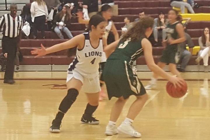 Calvary Chapel’s Tara Quintero defends Incline Village’s Elisabeth Stranzal duri ...