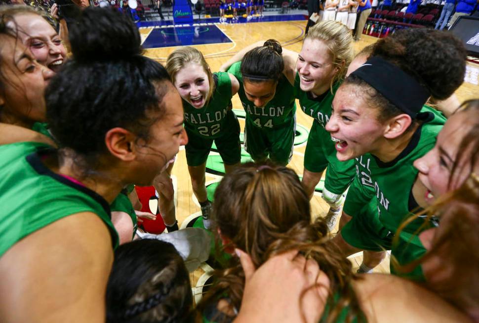 Churchill County players celebrate their win against Moapa Valley in the Class 3A girls bask ...