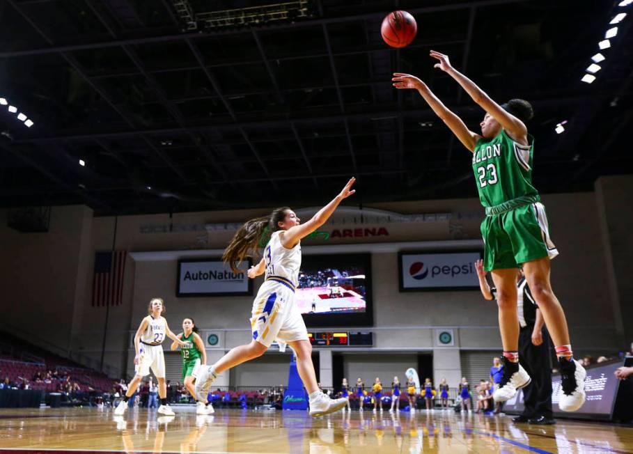 Churchill County’s Madison Whitaker (23) shoots over Moapa Valley’s Emilie Barra ...