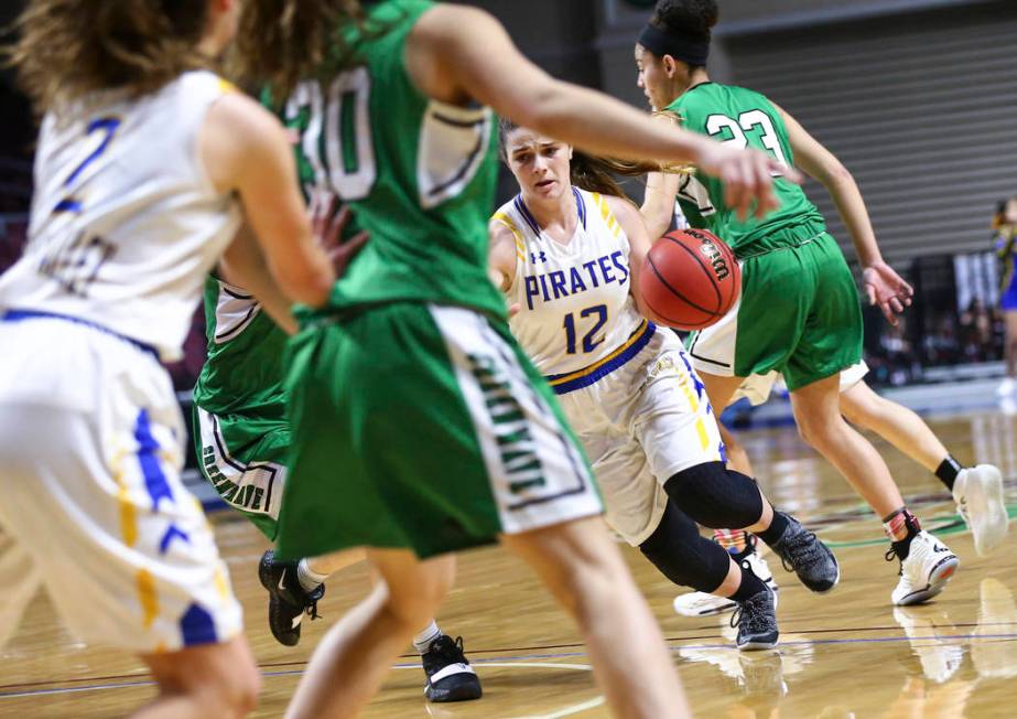 Moapa Valley’s Lainey Cornwall (12) moves the ball against Churchill County during the ...