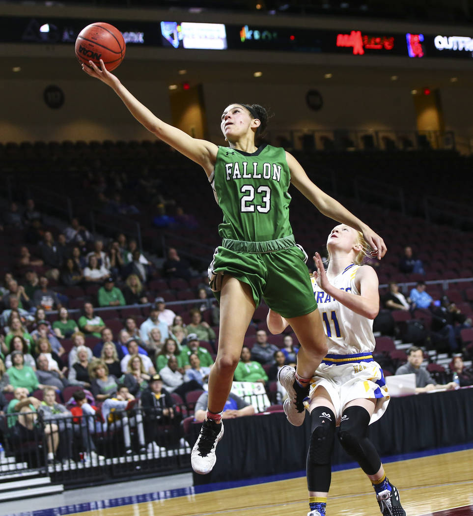 Churchill County’s Madison Whitaker (23) goes to the basket past Moapa Valley’s ...