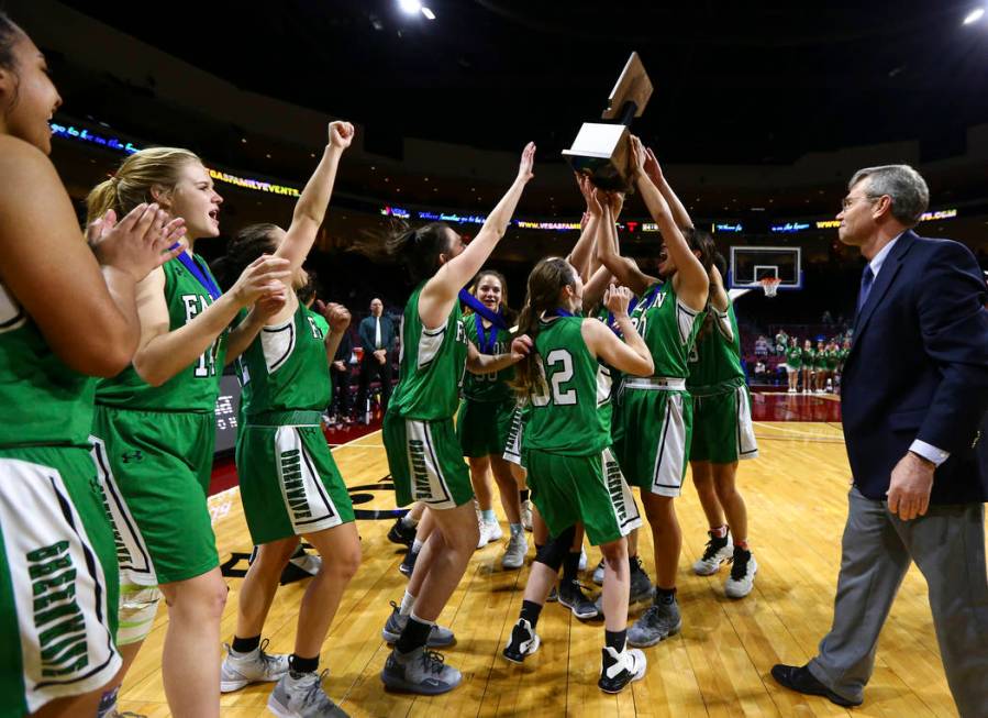 Churchill County players celebrate their win against Moapa Valley in the Class 3A girls bask ...