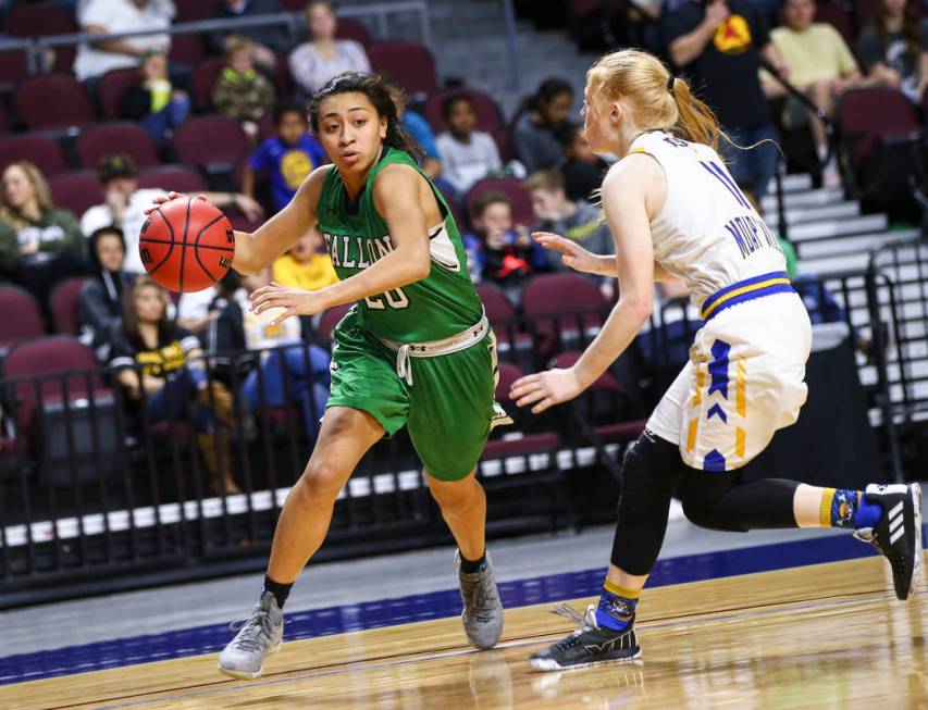 Churchill County’s Leilani Otuafi (20) moves the ball around Moapa Valley’s Kait ...