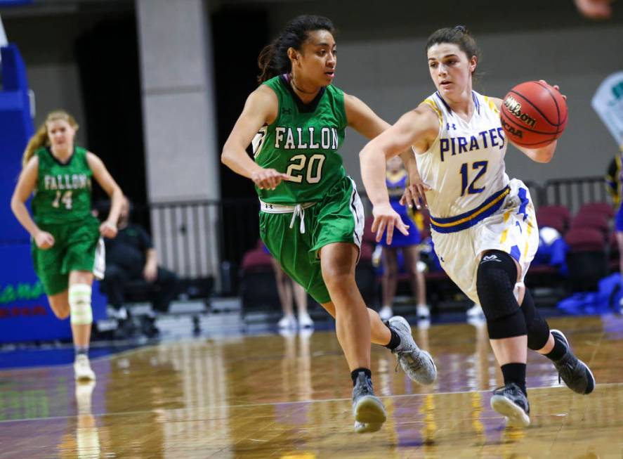 Moapa Valley’s Lainey Cornwall (12) drives to the basket against Churchill County&#821 ...