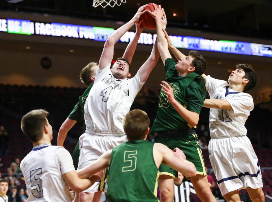 The Meadows forward Joe Epstein (4) reaches out for a rebound against Incline guard Brody Th ...