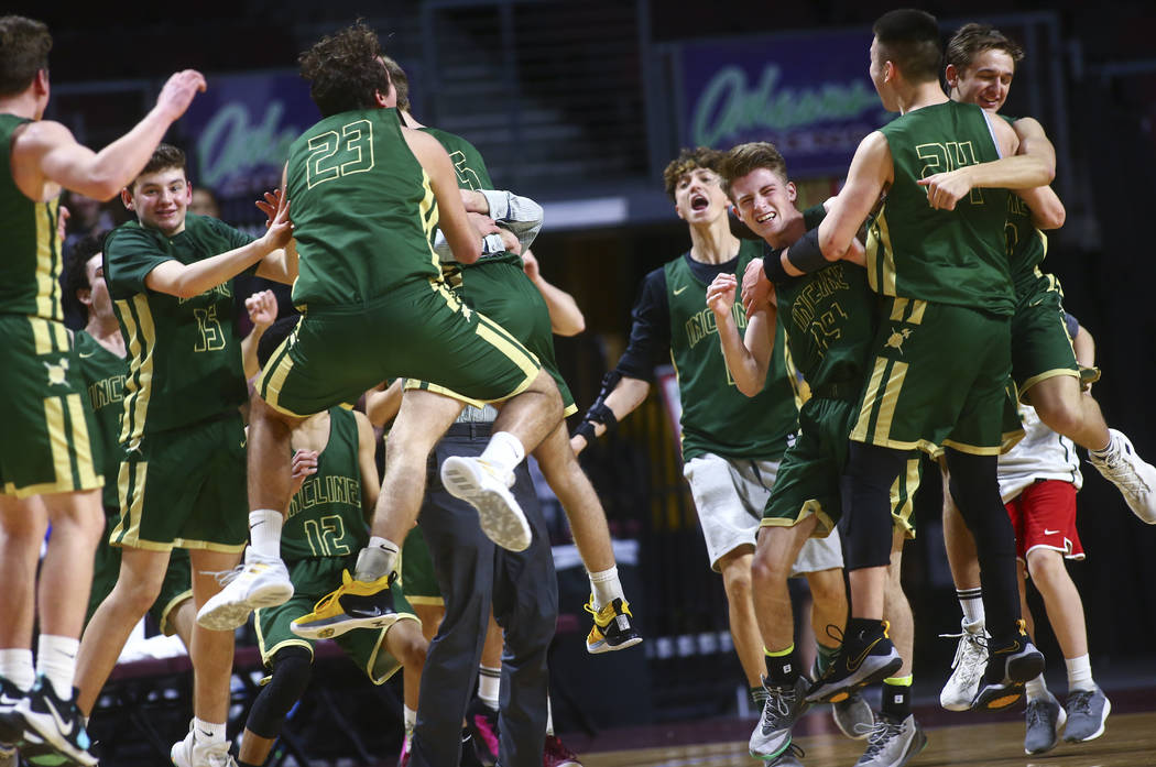 Incline players celebrate their win over The Meadows in the Class 2A boys basketball state c ...