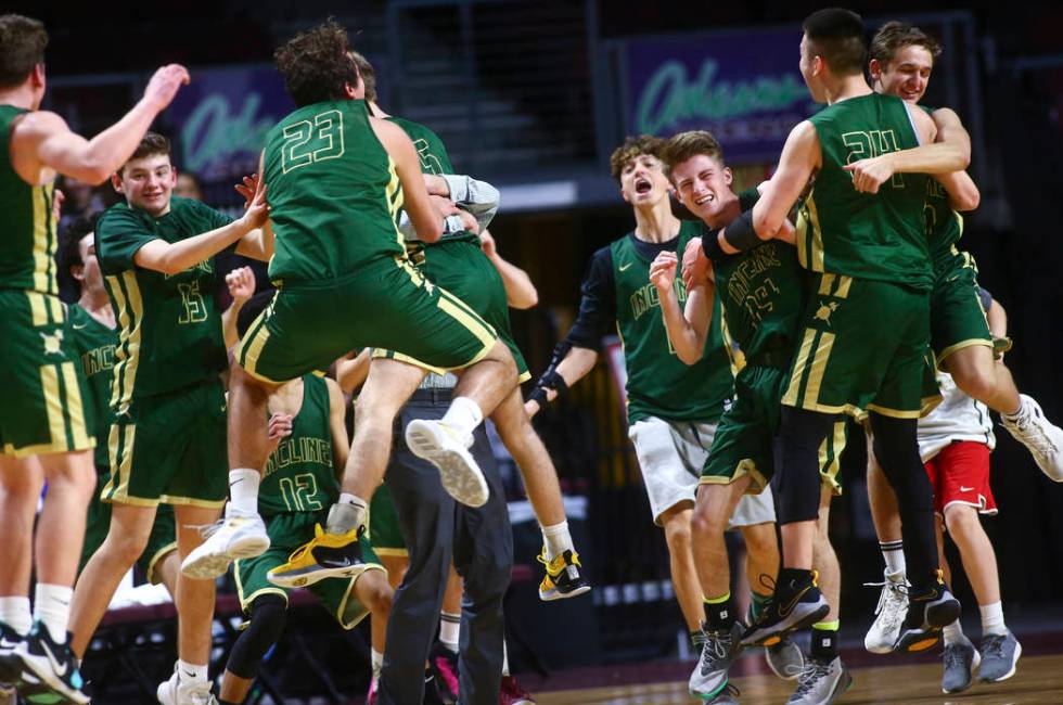 Incline players celebrate their win over The Meadows in the Class 2A boys basketball state c ...