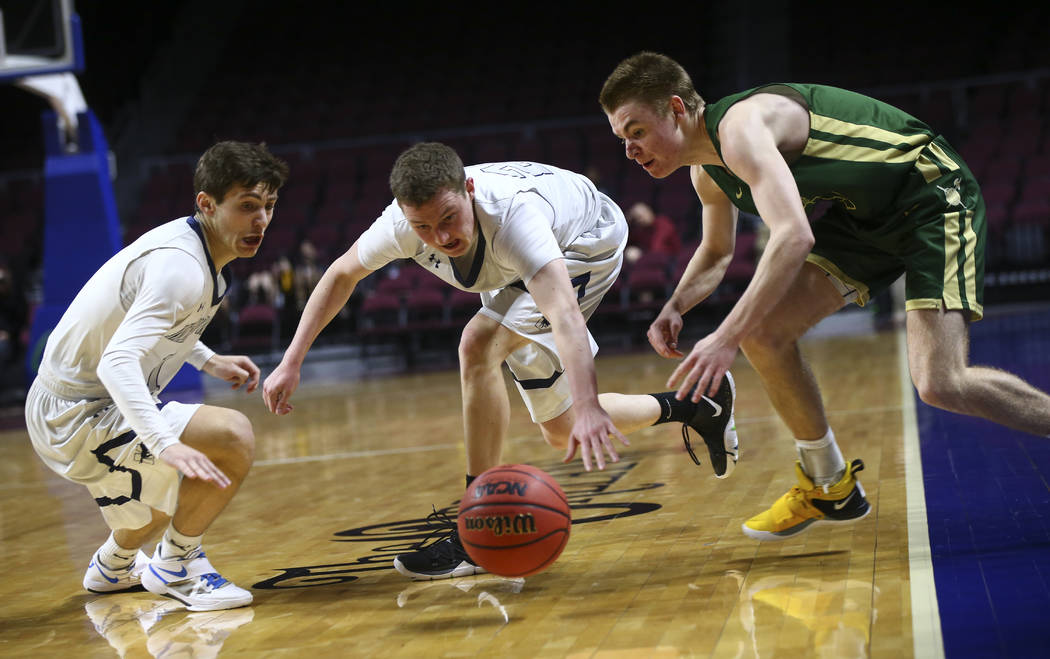 The Meadows’ Noah Klein, left, and Allen Fridman, second from left, go after a loose b ...