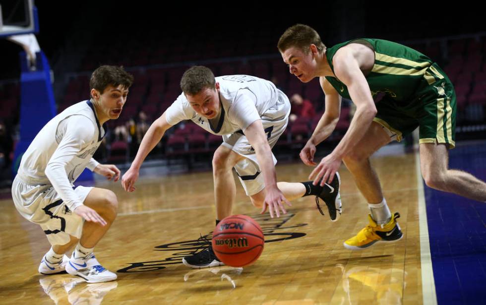 The Meadows’ Noah Klein, left, and Allen Fridman, second from left, go after a loose b ...