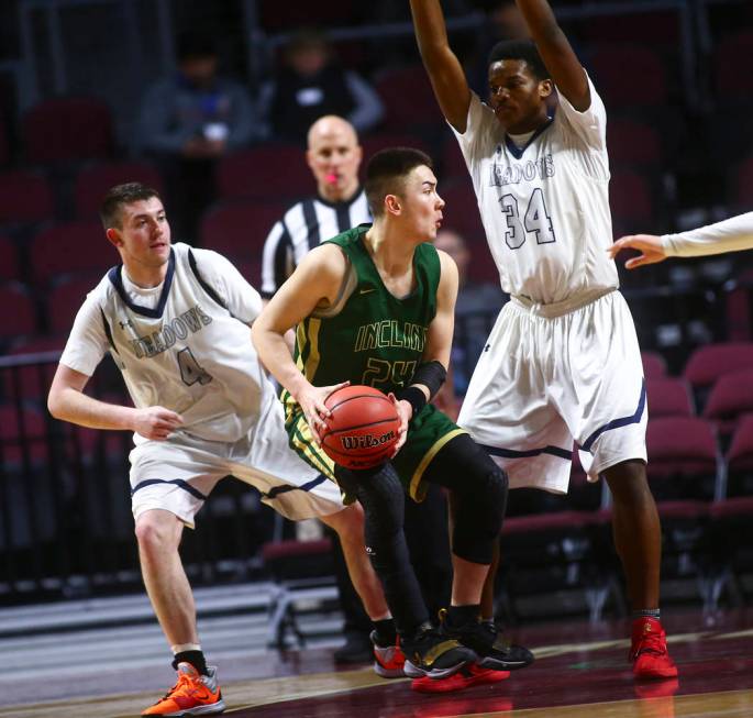 Incline’s TT Valosek (24) moves the ball against The Meadows’ Joe Epstein (4) an ...