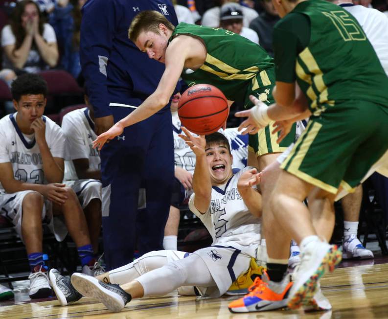 The Meadows guard Trey Covell (5) passes the ball under pressure from Incline during the sec ...